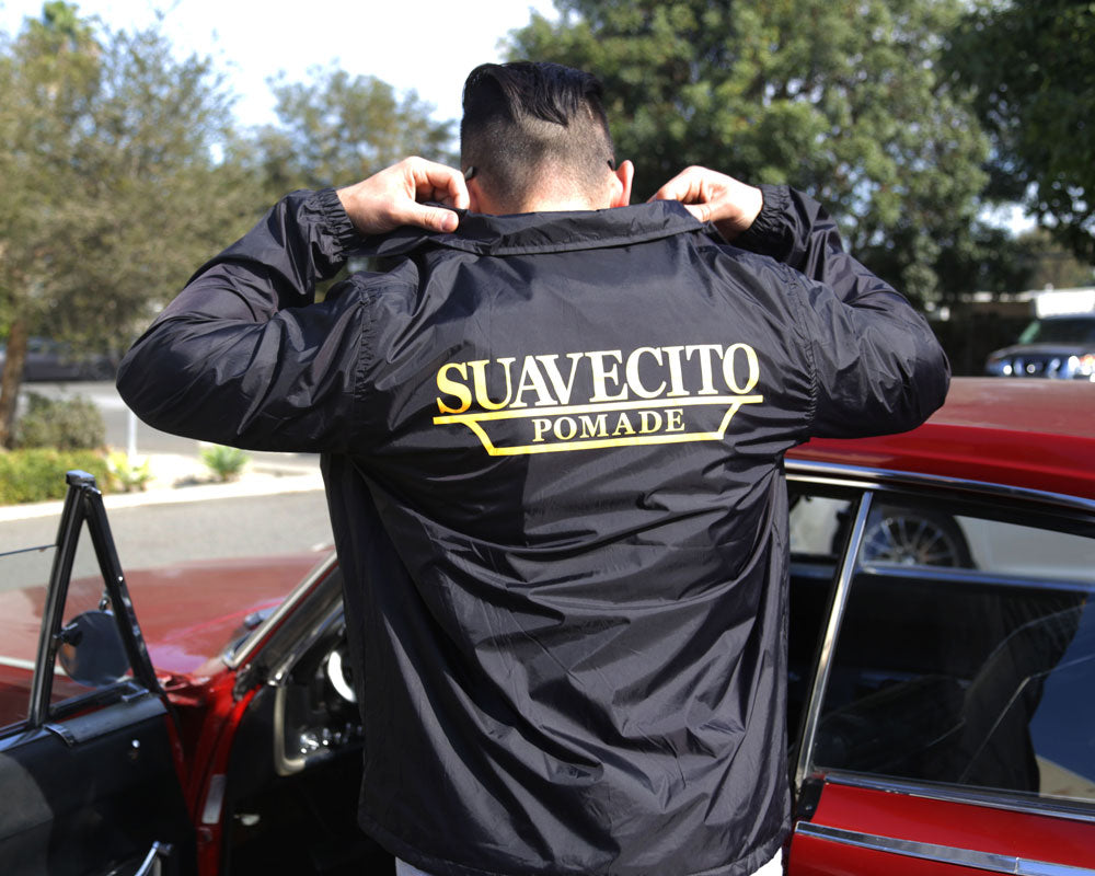 The Club Windbreaker - Model is wearing a size large windbreaker