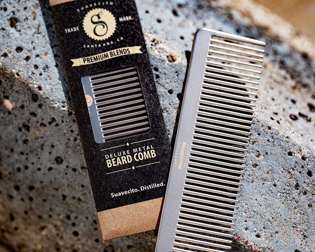 Deluxe Metal Beard Comb - cinematic next to packaging