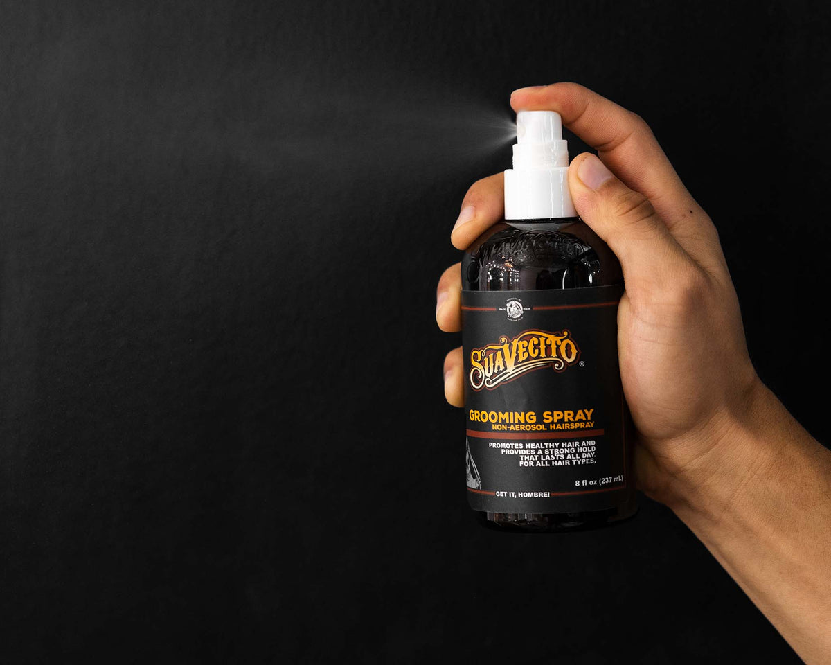8oz grooming spray being spritzed into the air 
