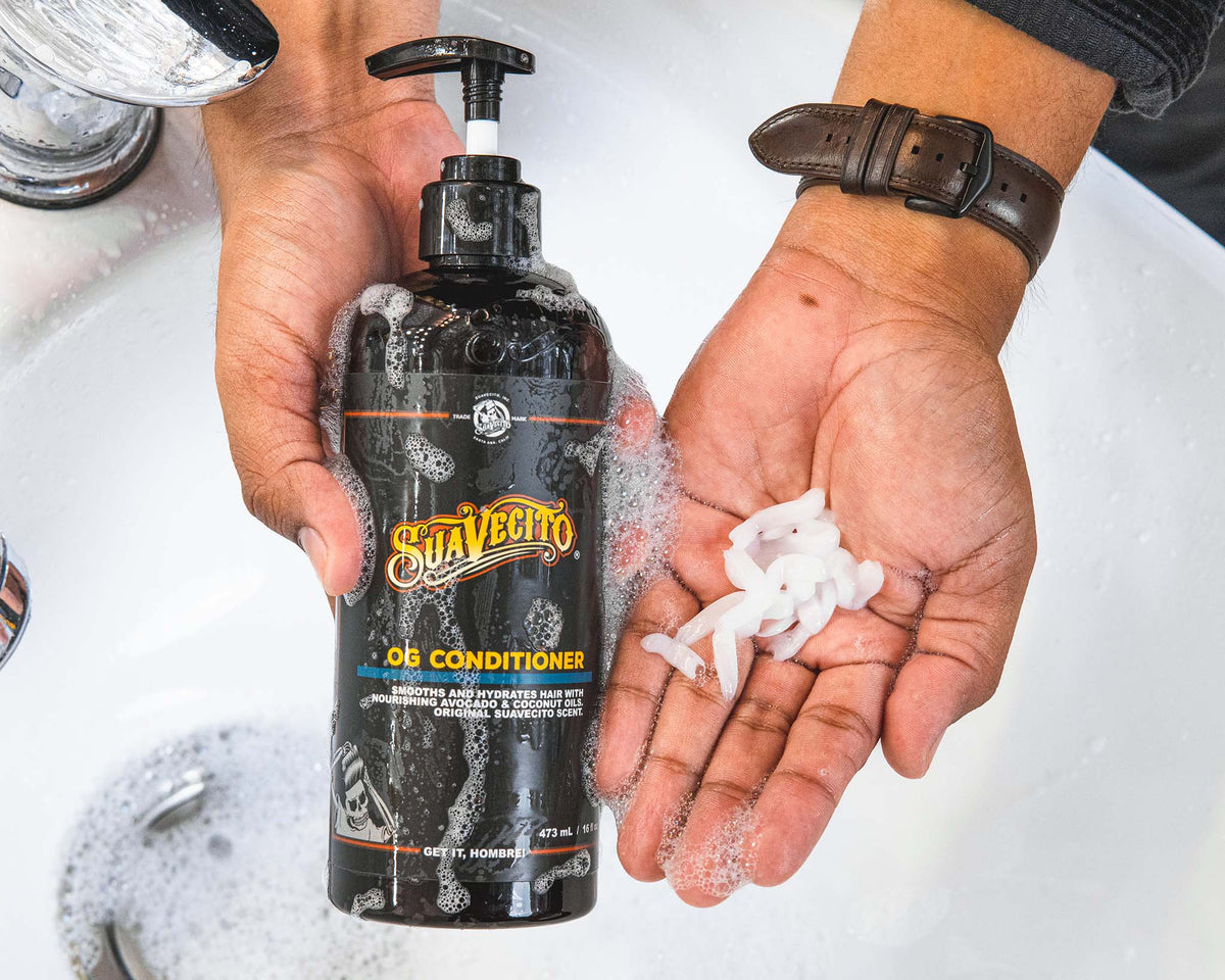 front of og conditioner bottle side by side with a palm full of pumped conditioner 