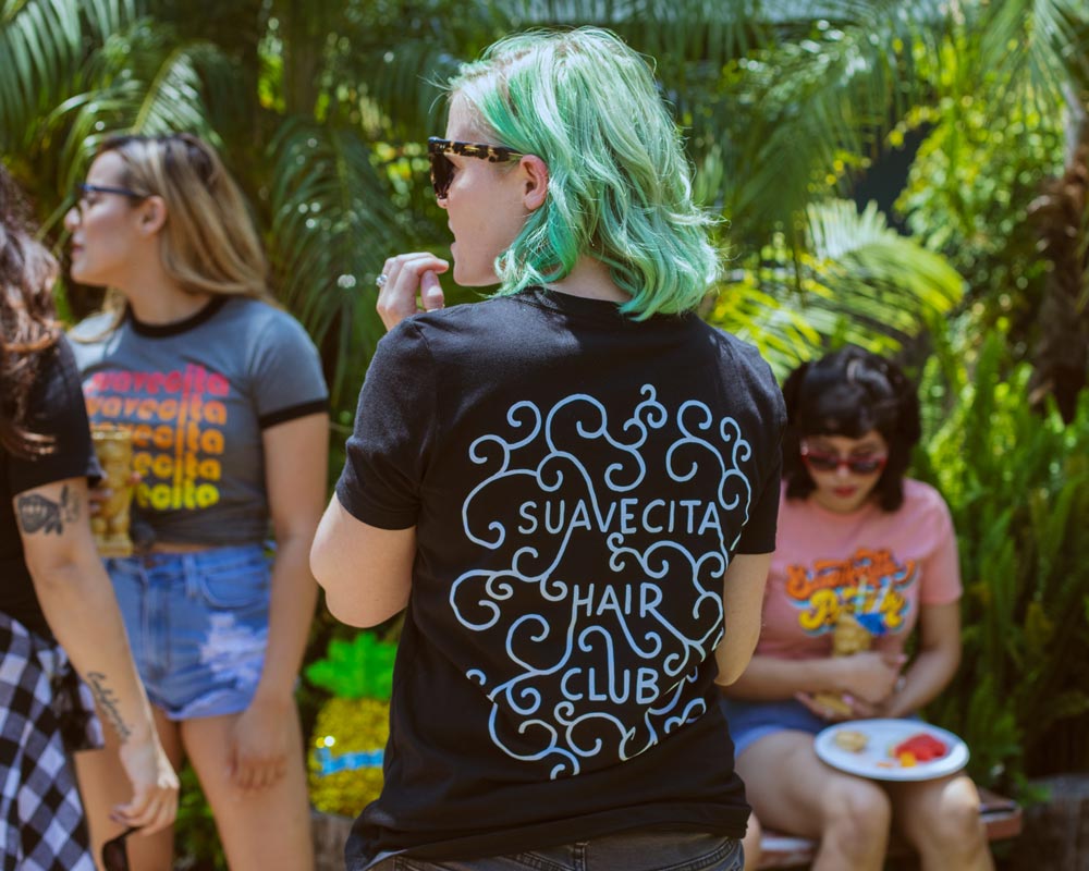 Model wearing the Hair Club V-Neck Tee