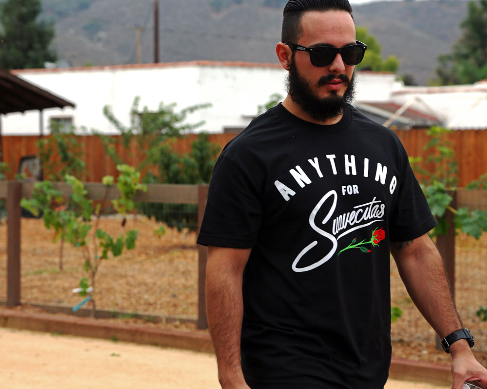 Anything for Suavecitas Tee - Model is wearing a size large tee.